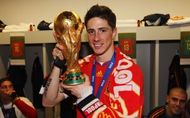 Liverpool's Torres with the world cup trophy (notice scarf)